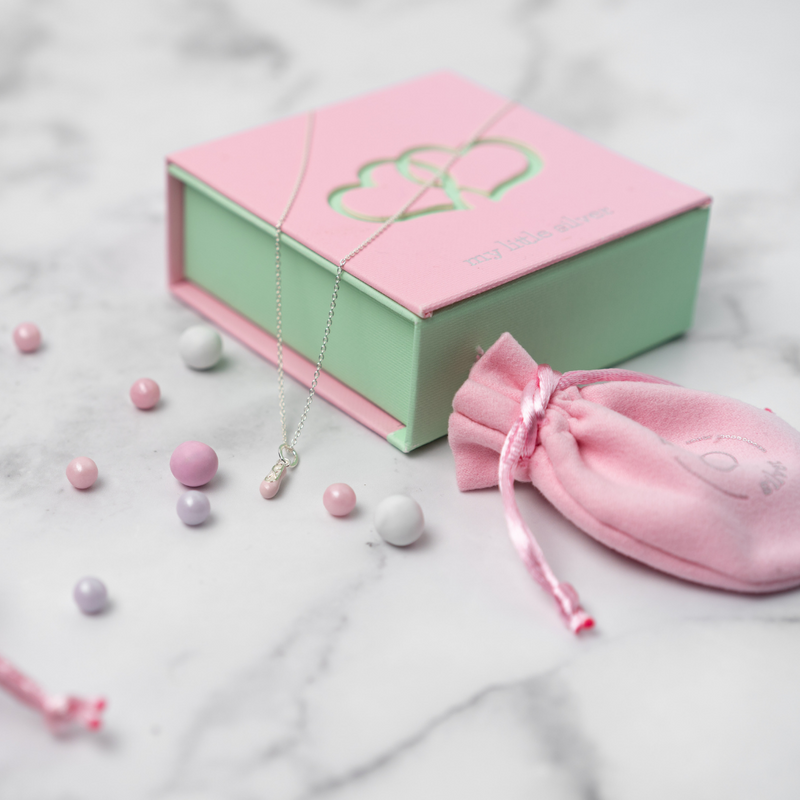 Flat Lay of a Ballet Slipper Necklace with My Little Silver Gift Box and Jewellery Pouch/Polishing Cloth