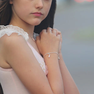 Tween Girl wearing Ballet Slipper Charm and Ballet Slipper Necklace in a Ballerina TuTu Dress 